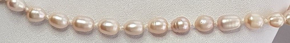 Palest pink baroque pearls, handknotted.