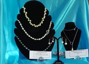 Detail of Marmalade Emma's stall showing pearl necklaces and earrings